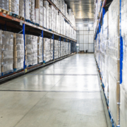 view down the aisle of a cold storage warehouse full of goods