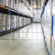 view down the aisle of a cold storage warehouse full of goods