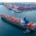 cargo ship being assisted by a tugboat while arriving in port