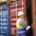shipyard worker inspecting a cargo container